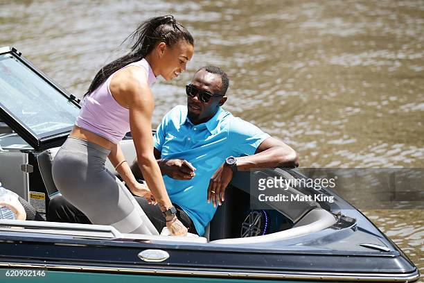 Usain Bolt travels by boat with Australian Olympian Morgan Mitchell to the launch of Nitro Athletics on November 4, 2016 in Melbourne, Australia.