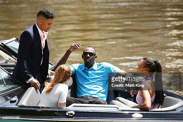 Usain Bolt travels by boat with Australian Olympians Anneliese Rubie and Morgan Mitchell as well as John Steffensen to the launch of Nitro Athletics...
