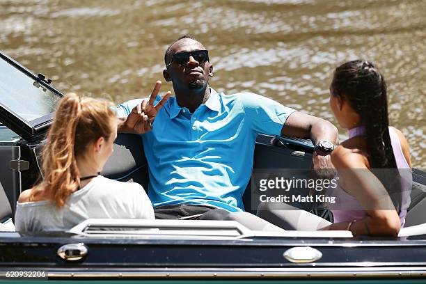 Usain Bolt travels by boat with Australian Olympians Anneliese Rubie and Morgan Mitchell to the launch of Nitro Athletics on November 4, 2016 in...