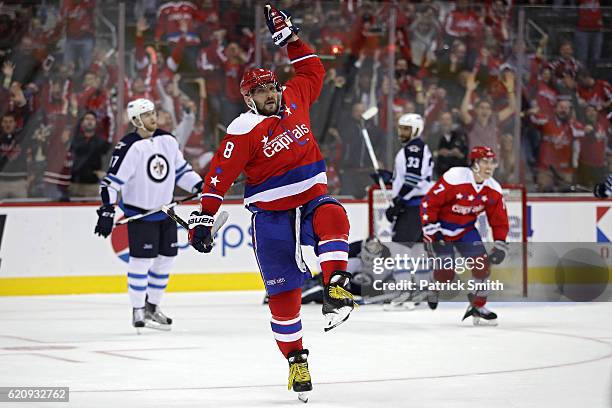 Alex Ovechkin of the Washington Capitals celebrates after scoring the game-winning goal against the Winnipeg Jets during overtime at Verizon Center...