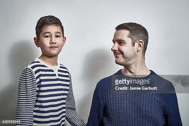 studio portrait of father and son together - proud father stock pictures, royalty-free photos & images