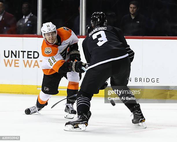 Travis Konecny of the Philadelphia Flyers shoots against Travis Hamonic of the New York Islanders during their game at the Barclays Center on...