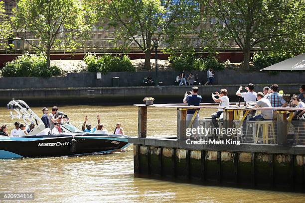 Usain Bolt travels by boat with Australian Olympians Anneliese Rubie and Morgan Mitchell to the launch of Nitro Athletics on November 4, 2016 in...