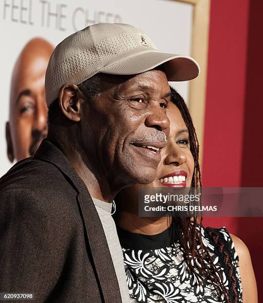 Danny Glover and wife Eliane Cavalleiro attend the premiere of Almost Christmas at the Regency Village theatre in Westwood, California on November 3,...