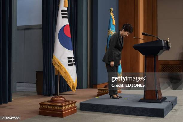 South Korea's President Park Geun-Hye bows prior to delivering an address to the nation at the presidential Blue House in Seoul on November 4, 2016....