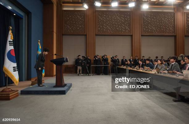 South Korea's President Park Geun-Hye bows prior to delivering an address to the nation at the presidential Blue House in Seoul on November 4, 2016....