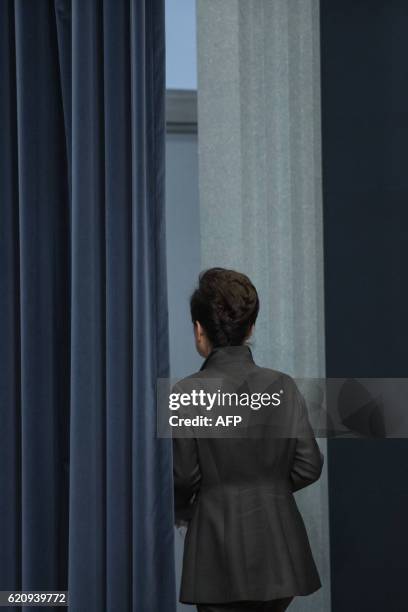 South Korea's President Park Geun-Hye exits after delivering an address to the nation at the presidential Blue House in Seoul on November 4, 2016....