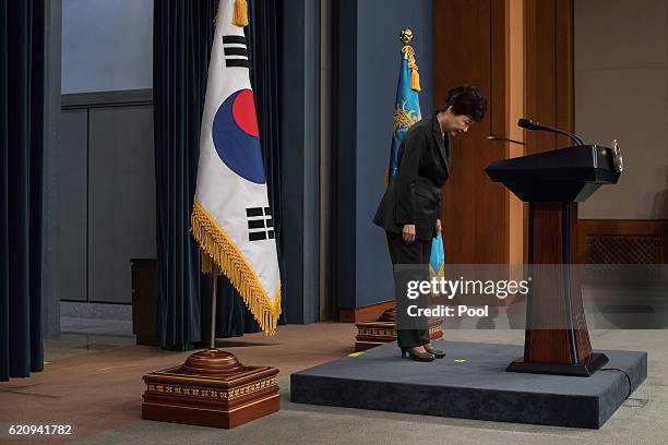 South Korean President Park Geun-Hye bows prior to delivering an address to the nation, at the presidential Blue House on November 4, 2016 in Seoul,...