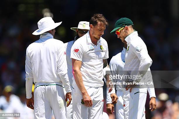 Dale Steyn of South Africa reacts after suffering a shoulder injury while bowling during day two of the First Test match between Australia and South...