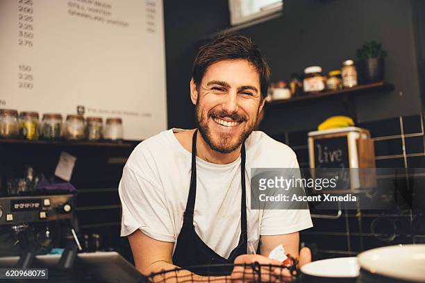 portrait of happy barrista at espresso bar - bar man t shirt ストックフォトと画像