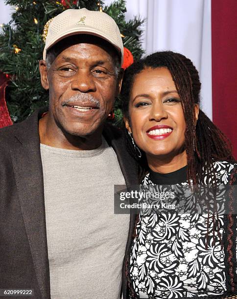 Actor Danny Glover and wife Elaine Cavalleiro attend the premiere of Universal's 'Almost Christmas' at Regency Village Theatre on November 3, 2016 in...