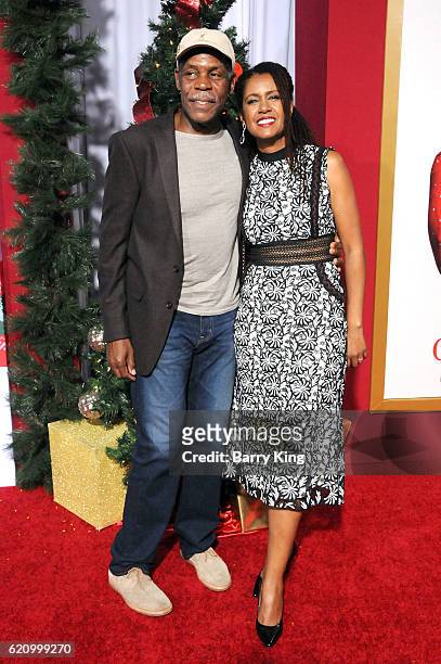 Actor Danny Glover and wife Elaine Cavalleiro attend the premiere of Universal's 'Almost Christmas' at Regency Village Theatre on November 3, 2016 in...