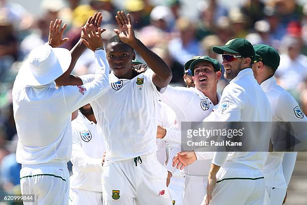 Kagiso Rabada of South Africa celebrates the wicket of Adam Voges of Australia during day two of the First Test match between Australia and South...