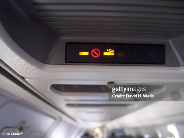 no smoking" sign on airplan - no smoking sign stock pictures, royalty-free photos & images