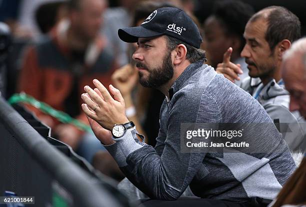 Thierry Ascione, coach of Jo-Wilfried Tsonga of France attends his second round victory against Albert Ramos-Vinolas of Spain during the BNP Paribas...