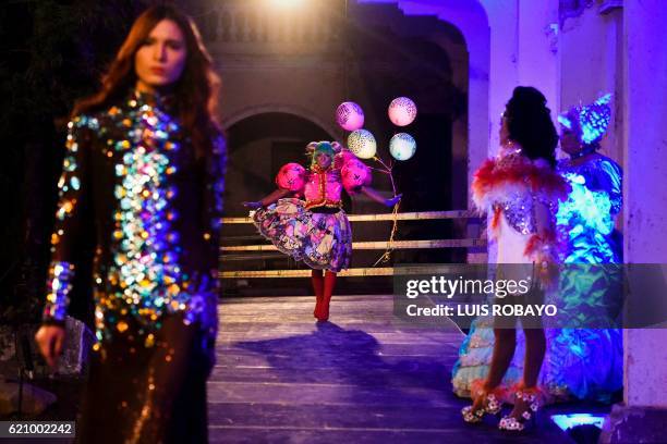 Men of the LGBTI community model creations by Colombian designer Diego Morales during the Walkway Inclusion fashion show in Cali, Colombia on...