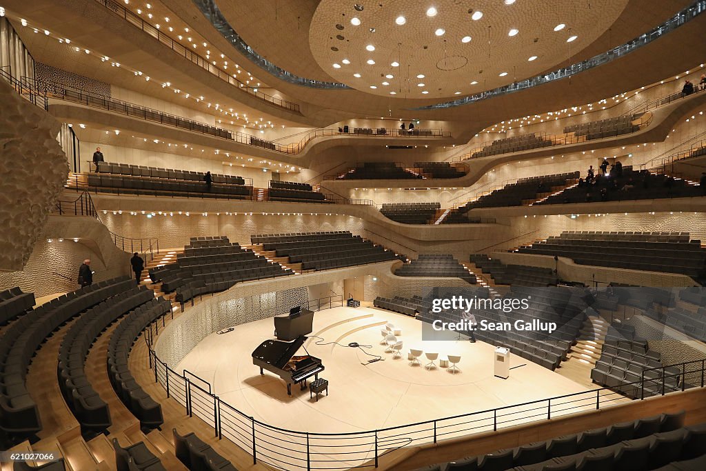 Visitors walk through the large hall of the newly-completed... News ...