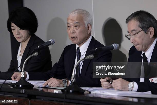 Yoichiro Nomura, chief financial officer of Takata Corp., center, speaks during a news conference at the Tokyo Stock Exchange in Tokyo, Japan, on...