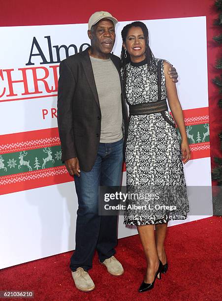 Actor Danny Glover and wife Eliane Cavalleiro arrive for the Premiere Of Universal's "Almost Christmas" held at Regency Village Theatre on November...