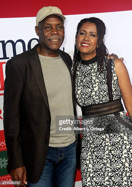 Actor Danny Glover and wife Eliane Cavalleiro arrive for the Premiere Of Universal's "Almost Christmas" held at Regency Village Theatre on November...