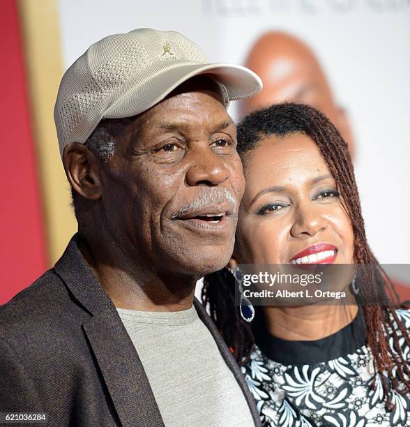 Actor Danny Glover and wife Eliane Cavalleiro arrive for the Premiere Of Universal's "Almost Christmas" held at Regency Village Theatre on November...