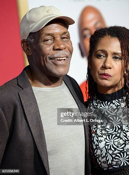 Actor Danny Glover and wife Eliane Cavalleiro arrive for the Premiere Of Universal's "Almost Christmas" held at Regency Village Theatre on November...