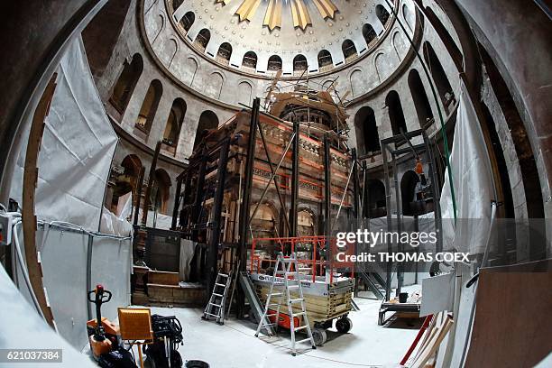 Picture taken on November 4, 2016 at the Church of the Holy Sepulchre in Jerusalems Old City shows the Edicule surrounding the Tomb of Jesus being...