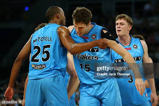 Robert Loe of the Breakers celebrates hitting a three pointer with team mate Akil Mitchell of the Breakers during the round five NBL match between...