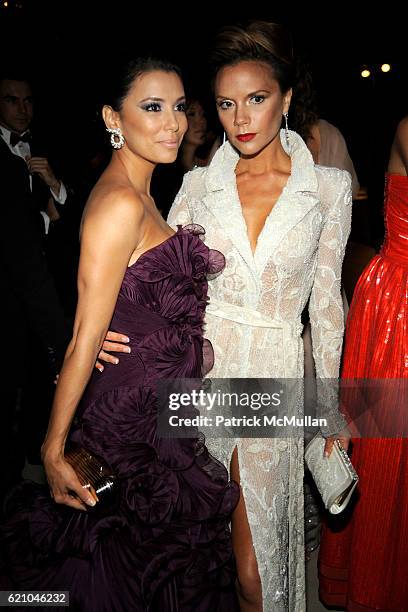 Eva Longoria Parker and Victoria Beckham attend THE COSTUME INSTITUTE GALA: "SUPERHEROES" with honorary chair GIORGIO ARMANI at The Metropolitan...