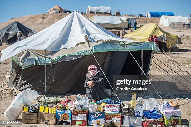 Syrians who fled their homes due to Civil war in Syria, take shelter near Turkish border after the region was cleared as part of Turkeys Operation...