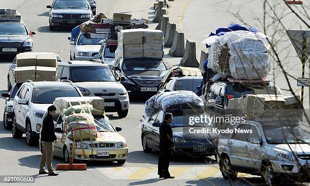 South Korea - South Korean vehicles loaded with industrial products and raw materials arrive at the inter-Korean transit office in Paju, South Korea,...