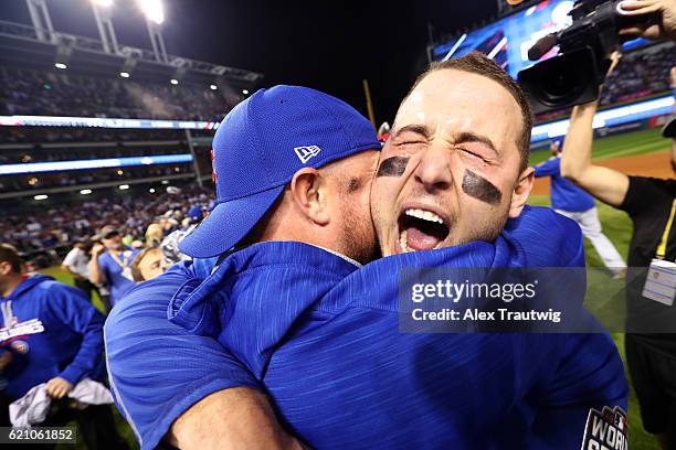 Anthony Rizzo and Jon Lester of the Chicago Cubs celebrate on the field after defeating the Cleveland Indians in Game 7 of the 2016 World Series at...