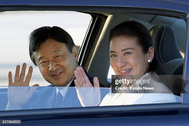 Netherlands - Japanese Crown Prince Naruhito and Crown Princess Masako wave to reporters upon arriving in Amsterdam on April 28 to attend the...