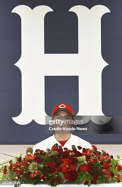 Retired Hiroshima Carp right-hander Hiroki Kuroda attends a press conference in the western Japan city of Hiroshima on Nov. 4, 2016. Kuroda, who...