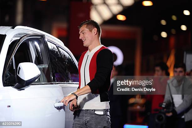 Toni Kroos of Real Madrid smiles before getting into his new Audi car for the 2016/2017 season at Carlos Sainz Center on November 4, 2016 in Madrid,...