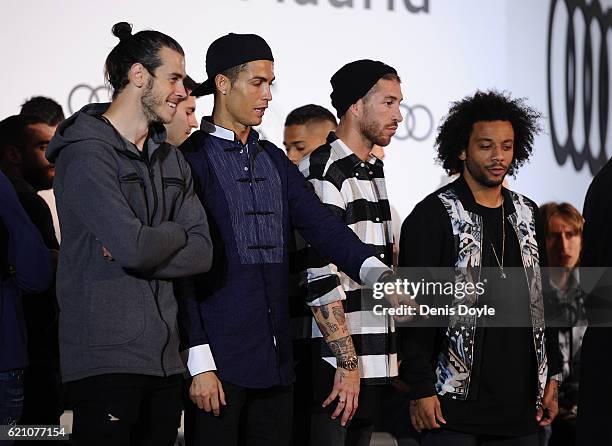 Cristiano Ronaldo of Real Madrid chats with teammate Gareth Bale during a promotional event for the German carmaker Audi at Carlos Sainz Center on...