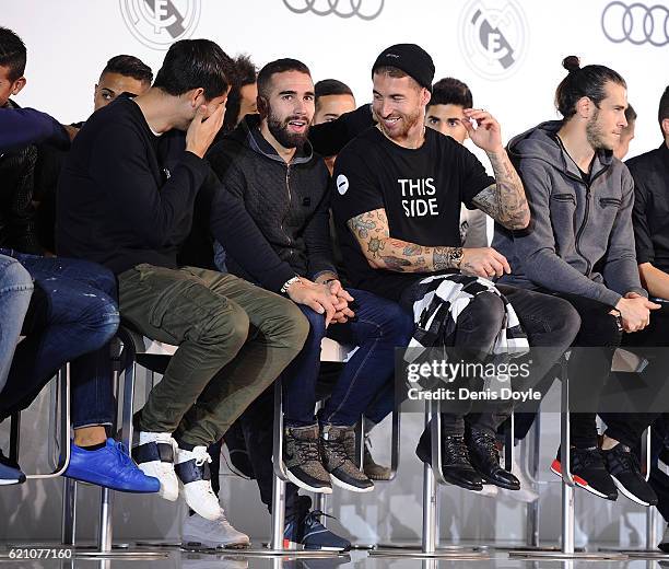 Sergio Ramos of Real Madrid chats with teammates Alvaro Morata and Daniel Carvajal during a promotional event for the German carmaker Audi at Carlos...