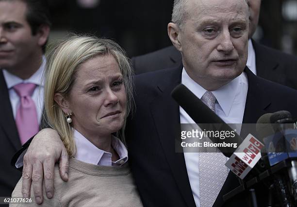 Bridget Anne Kelly, former deputy chief of staff for New Jersey Governor Chris Christie, left, reacts as attorney Michael Critchley speaks to members...