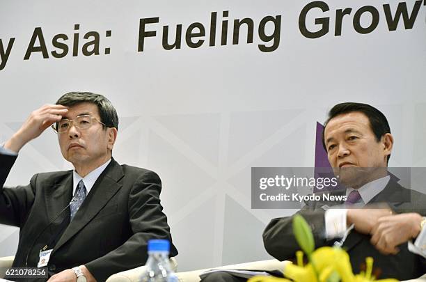 India - Japanese Finance Minister Taro Aso and Asian Development Bank President Takehiko Nakao attend a seminar in Greater Noida, northern India, on...