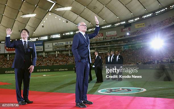 Japan - Former professional baseball players Hideki Matsui and Shigeo Nagashima acknowledge the crowd after receiving the People's Honor Award from...