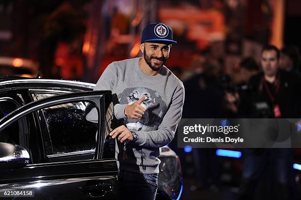 Karim Benzema of Real Madrid salutes before getting into his new Audi car for the 2016/2017 season at Carlos Sainz Center on November 4, 2016 in...