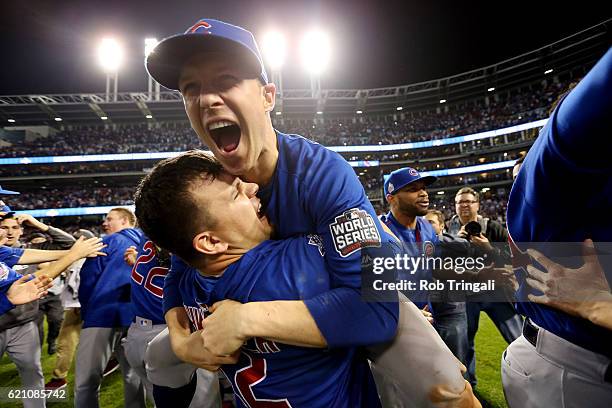 Kyle Schwarber and Chris Coghlan of the Chicago Cubs celebrate on the field after defeating the Cleveland Indians in Game 7 of the 2016 World Series...