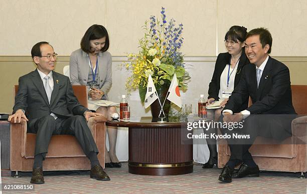 Japan - South Korean Environment Minister Yoon Seong Kyu and Japanese Environment Minister Nobuteru Ishihara hold talks at a hotel in Kitakyushu,...