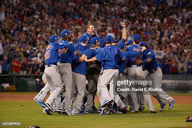 World Series: Chicago Cubs players victorious on field after winning Game 7 in 10th inning to win championship series vs Cleveland Indians at...