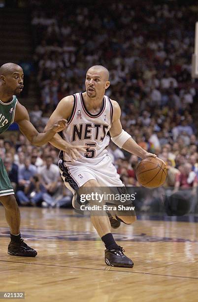 Point guard Jason Kidd of the New Jersey Nets drives past point guard Kenny Anderson of the Boston Celtics in Game five of the Eastern Conference...