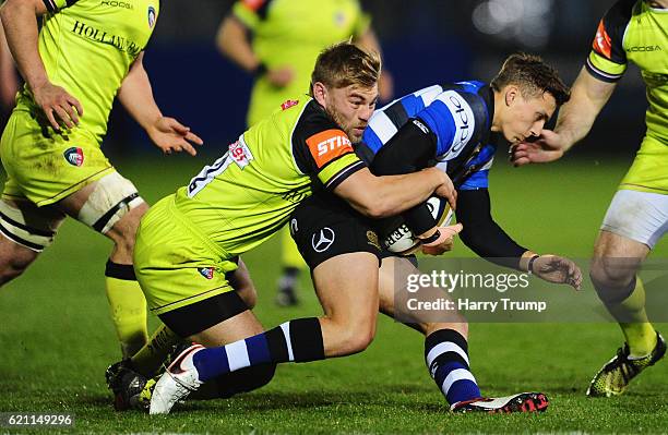 Darren Atkins of Bath Rugby is tackled by Jack Roberts of Leicester Tigers during the Anglo-Welsh Cup match between Bath Rugby and Leicester Tigers...