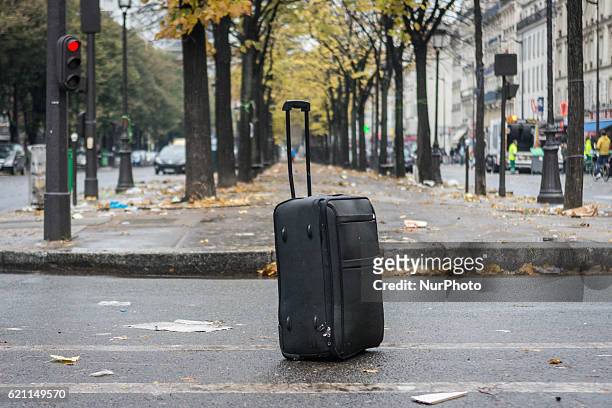 An suitcase abandoned during the evacuation of a makeshift camp near Stalingrad metro station in Paris on November 4 one of several camps sprouting...