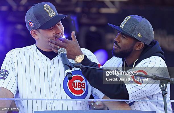 Dexter Fowler of the Chicago Cubs checks for tears after Anthony Rizzo gets choked up speaking to the crowd during the Chicago Cubs victory...