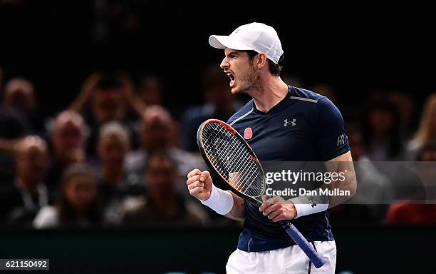 Andy Murray of Great Britain celebrates winning the first set during the Mens Singles quarter final match against Tomas Berdych of the Czech Republic...