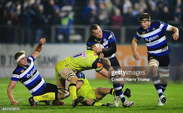 Rory Jennings of Bath Rugby is tackled by Tom Croft of Leicester Tigers during the Anglo-Welsh Cup match between Bath Rugby and Leicester Tigers at...